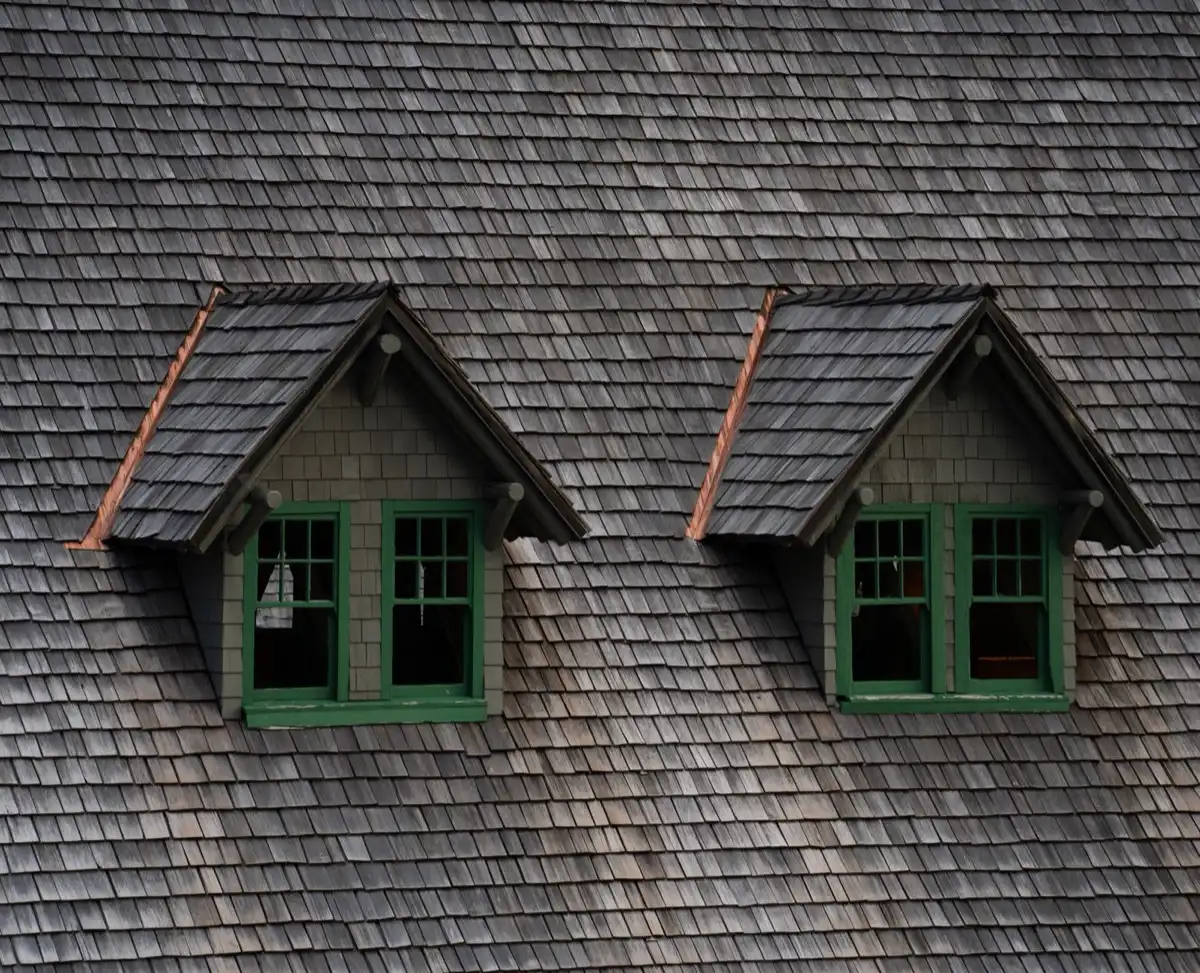 Dormers on a shingle roof in Anderson, IN, where step flashing and kickout flashing carry water past the walls